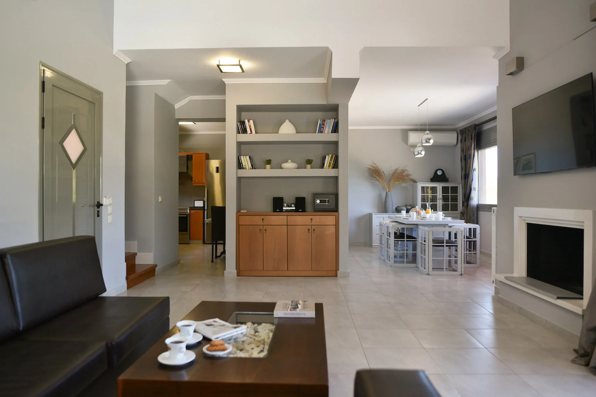 Bright open-plan living and dining area at Villa Skala Mare